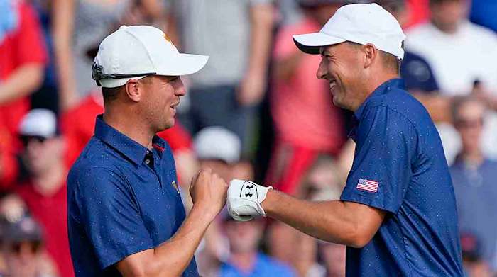 Justin Thomas (left) and Jordan Spieth share a fist bump on Saturday at the 2022 Presidents Cup.